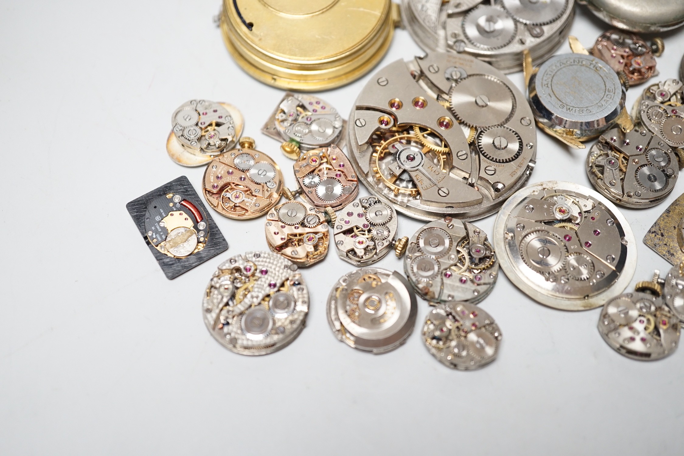 A collection of assorted wrist and pocket watch parts.
